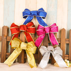 Golden glittered Christmas bow decoration for holiday celebrations