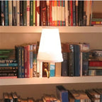 Christmas literary book lamp with warm glow illuminating a cozy room
