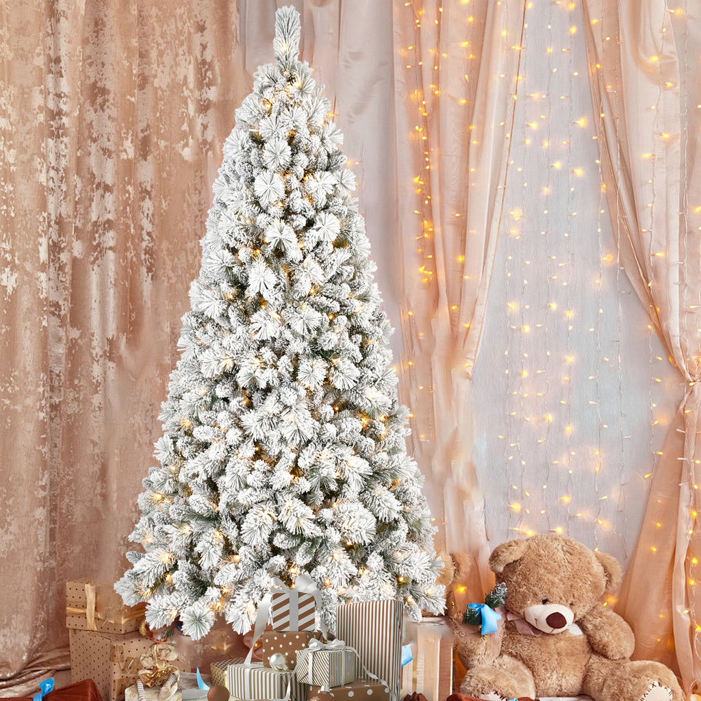 Detailed view of PVC hard needle flocked Christmas tree branches with lights