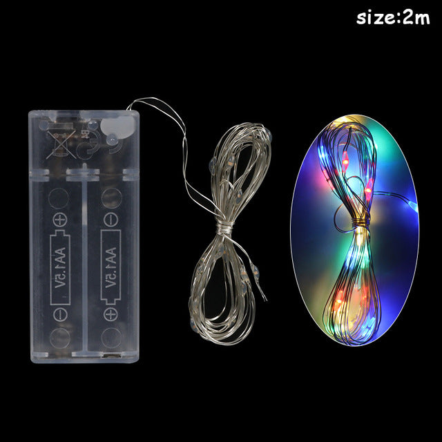 Festive Christmas string lights with holiday decorations and warm LED glow