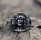 Close-up of cross symbol on stainless steel ring showing detailed craftsmanship