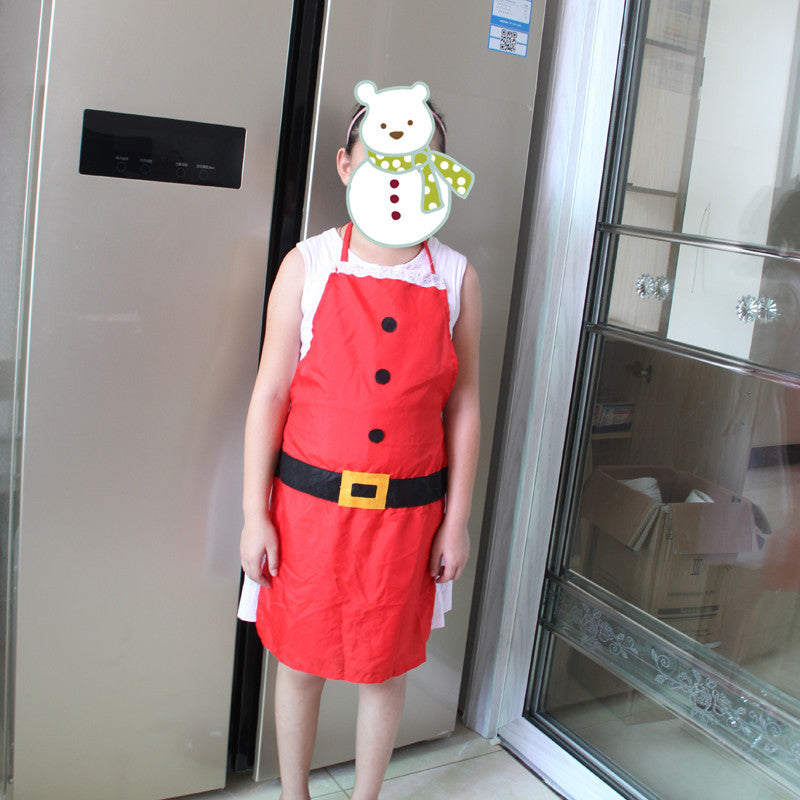 Woman wearing festive red Christmas apron in kitchen setting