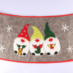 Christmas tree skirt with Nordic elders pattern styled beside wrapped presents