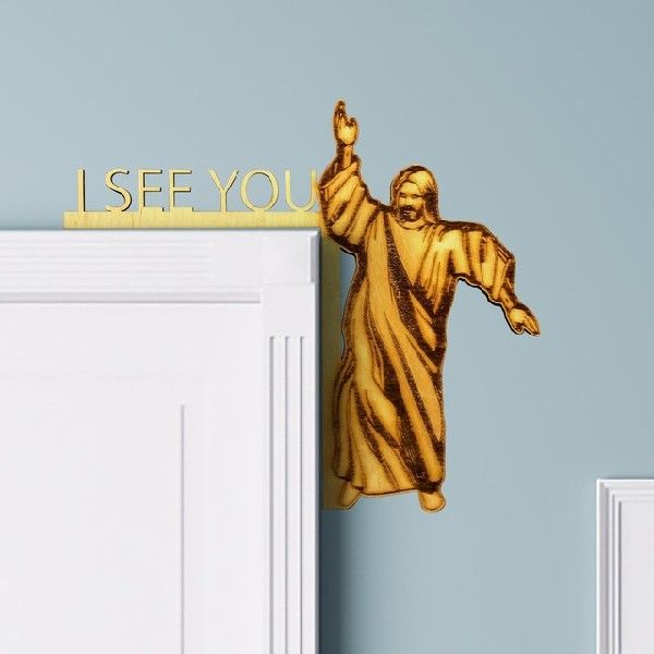 Close-up of wooden Jesus sculpture detail showing textured printing