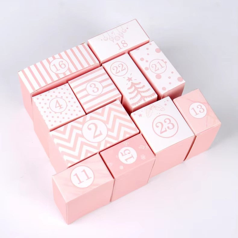 Open cardboard advent calendar box showing interior compartments for daily gifts and prayers - preparation