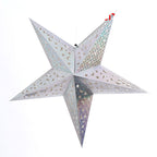 Cluster of Christmas star ornaments in various colors on tree