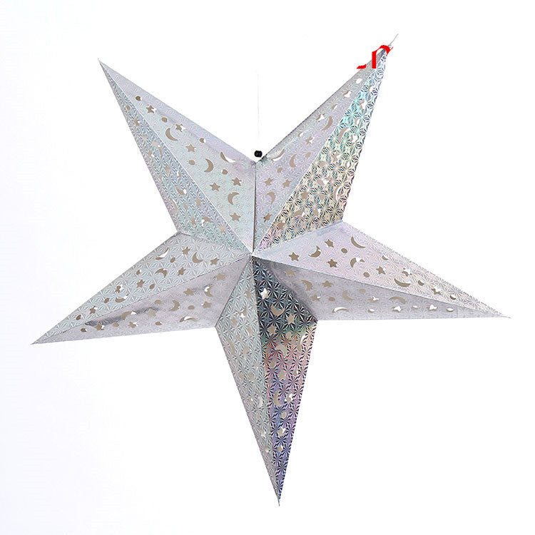 Cluster of Christmas star ornaments in various colors on tree