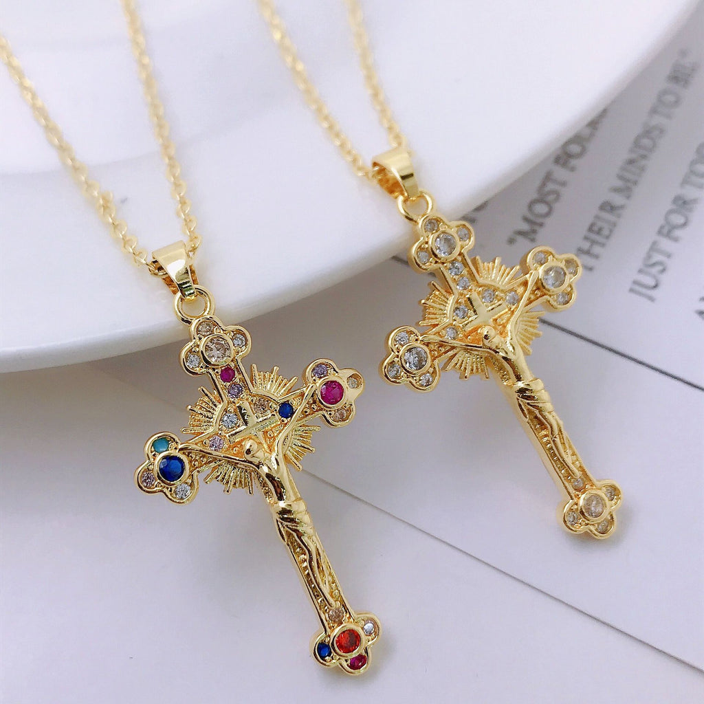 Front view of gold-tone oversized cross pendant necklace on mannequin