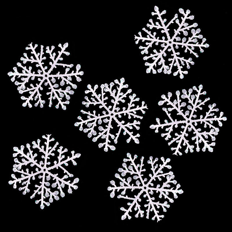 Cluster of snowflake Christmas ornaments in winter white tones