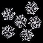 Cluster of snowflake Christmas ornaments in winter white tones
