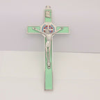 Luminous green St. Benedict's cross pendant with Jesus icon for Catholic devotion