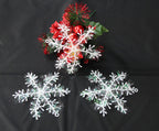 Set of plastic snowflake Christmas decorations on white background