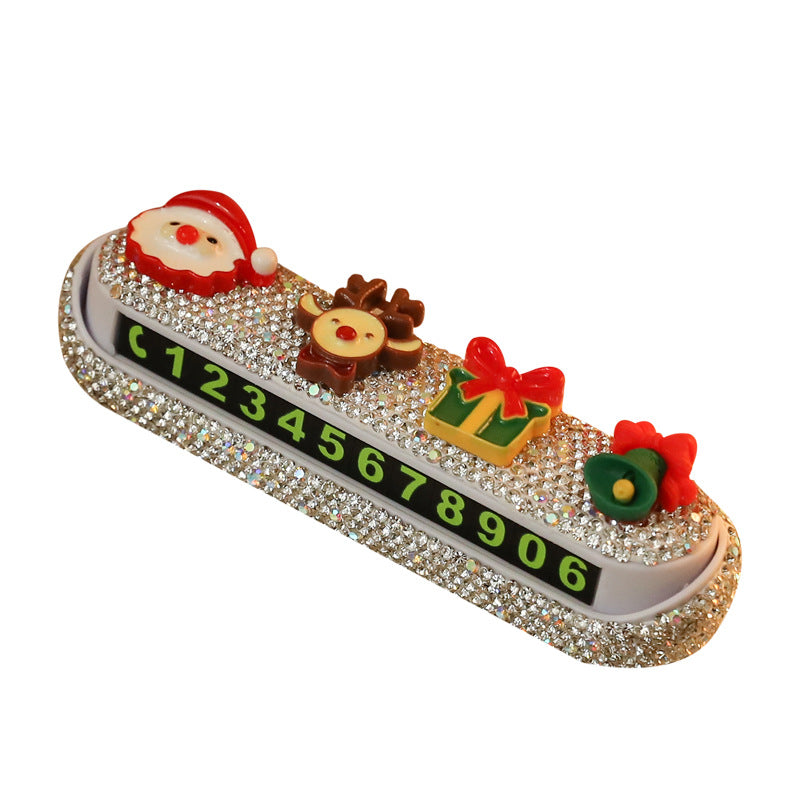 Christmas parking phone number sign with cartoon design displayed on table