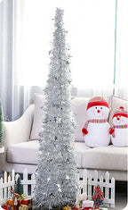 Collapsible sequin Christmas tree with sturdy metal stand in living room