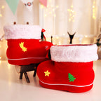 Red plastic candy boot ornament hanging for Christmas display