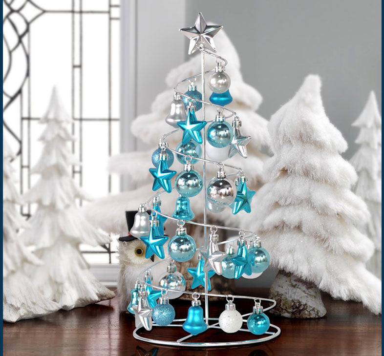 Red gold Christmas tree in office workspace setting