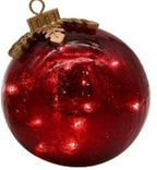 Close-up of glowing Christmas ornament detail in festive setting