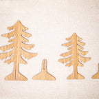 Multiple carved wooden Christmas ornaments showing variant designs and colors