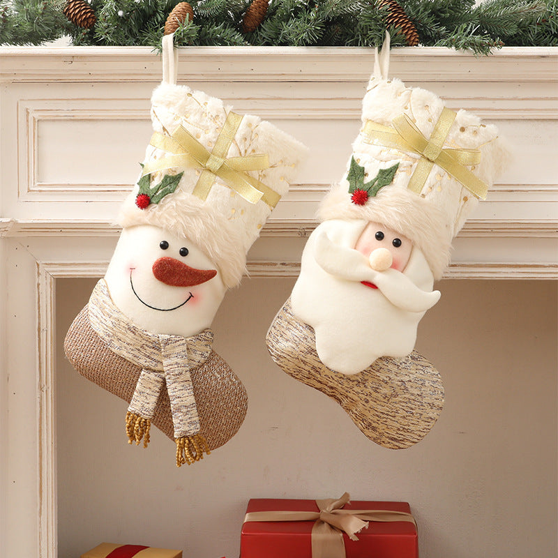 White Nordic Christmas stocking displayed on a festive mantel with greenery and candles