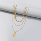 Elegant multi-layer faith necklace with geometric cross pendant detail