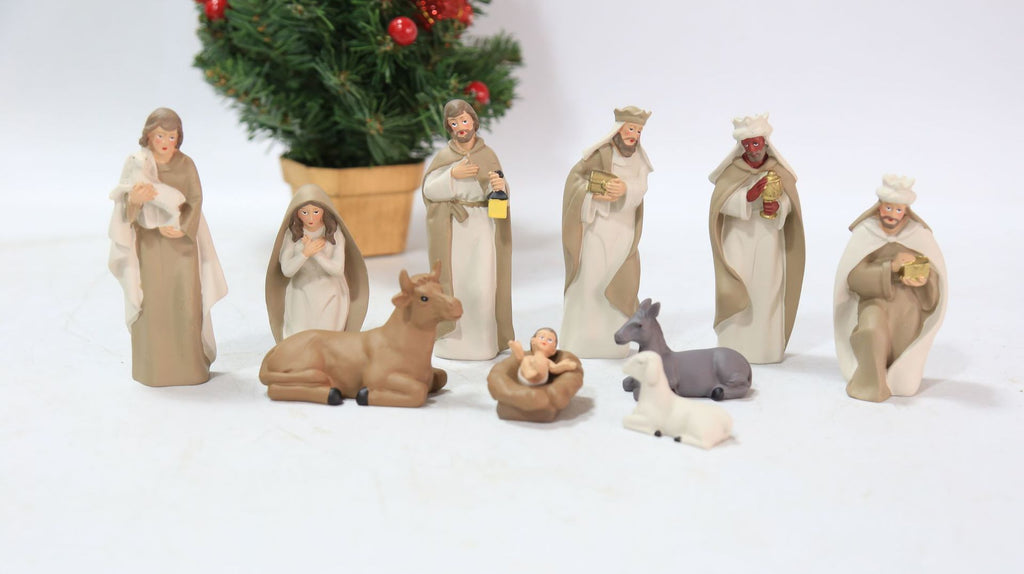 Catholic Church ornament set displayed on wooden shelf