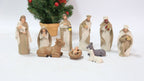 Catholic Church ornament set displayed on wooden shelf