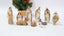 Catholic Church ornament set displayed on wooden shelf