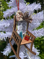 Christmas memorial ornament showing red and white decorative details