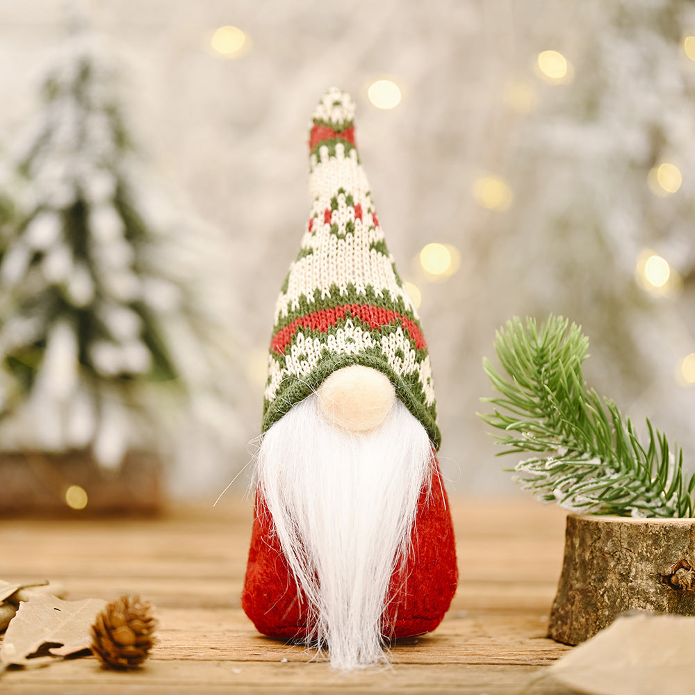 Snowflake hat forest doll ornament styled with red berries and holly for Christmas display