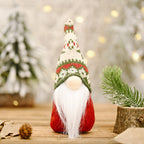 Snowflake hat forest doll ornament styled with red berries and holly for Christmas display