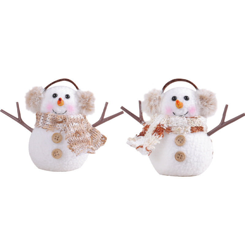 Ice man ornament with striped scarf hanging on Christmas tree
