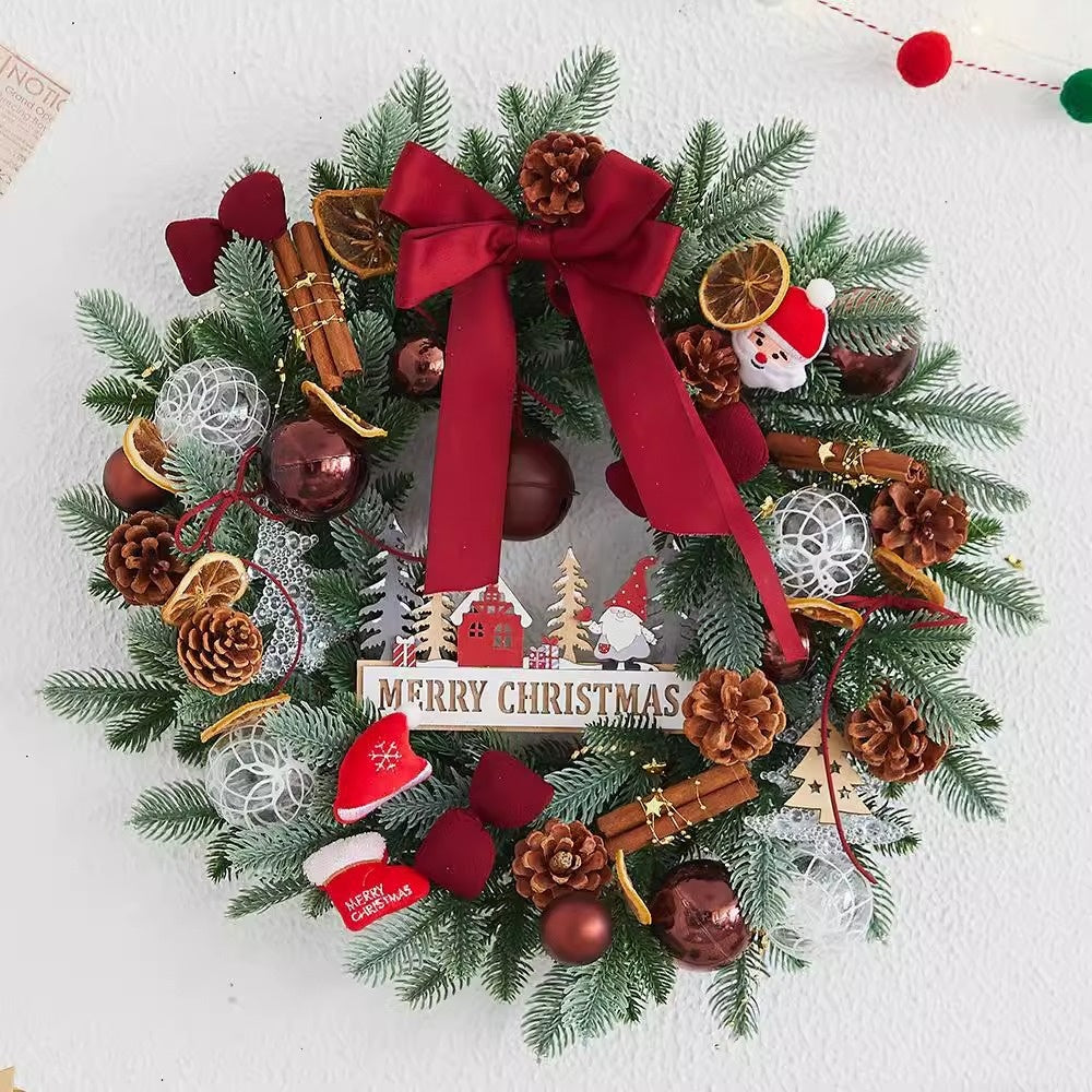 Holiday wreath displayed on rustic door with pine and Christmas ornaments