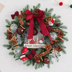 Holiday wreath displayed on rustic door with pine and Christmas ornaments