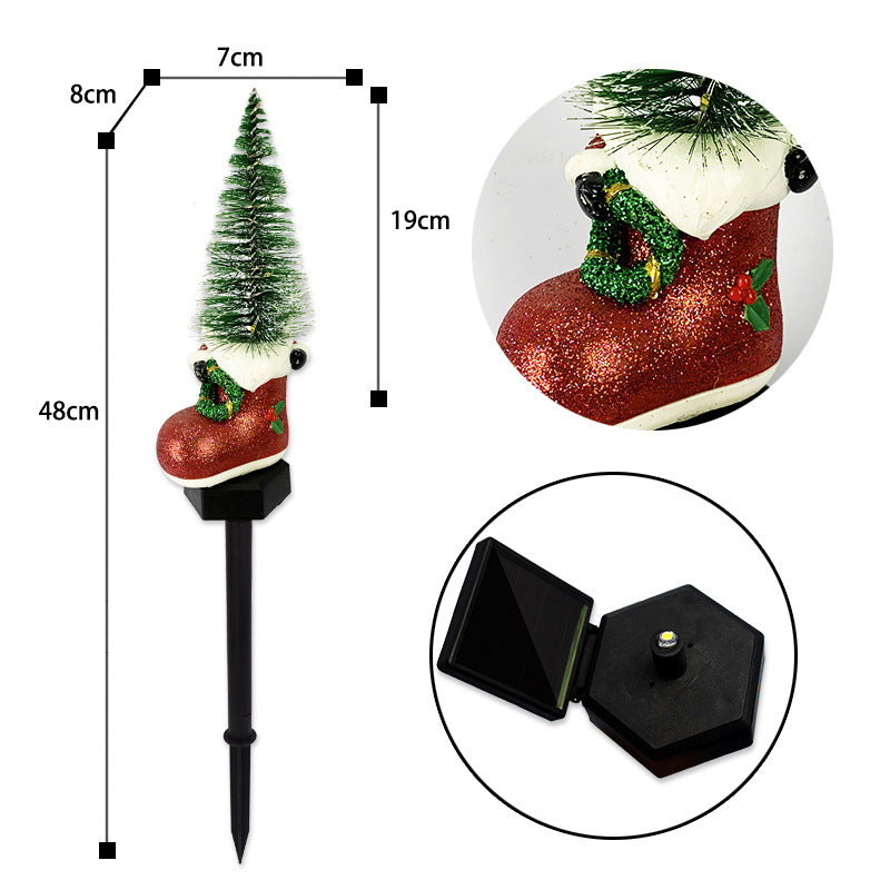 Solar-powered Christmas lamp illuminating pathway or walkway