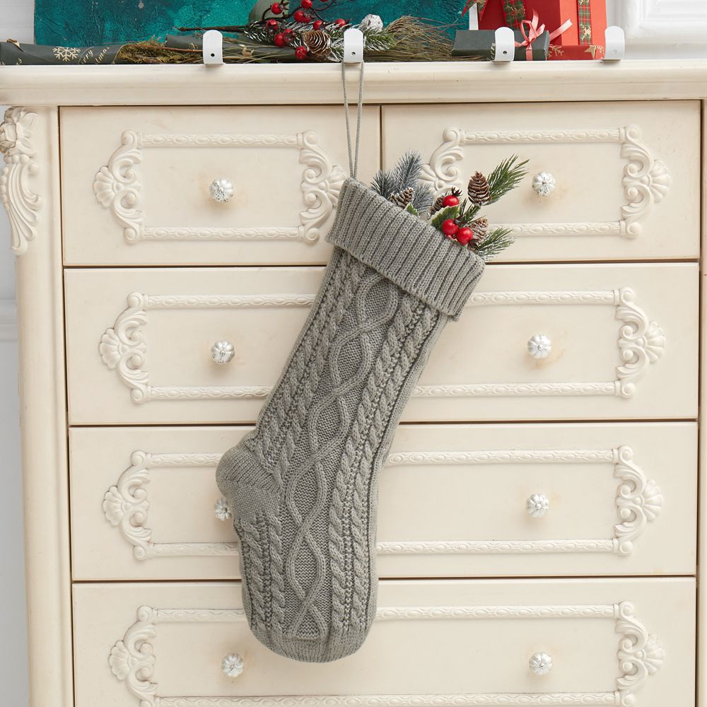 Set of colorful Christmas stockings in red green white variations for tree decorations