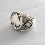 Religious ring featuring geometric cross and Sacred Heart symbolism