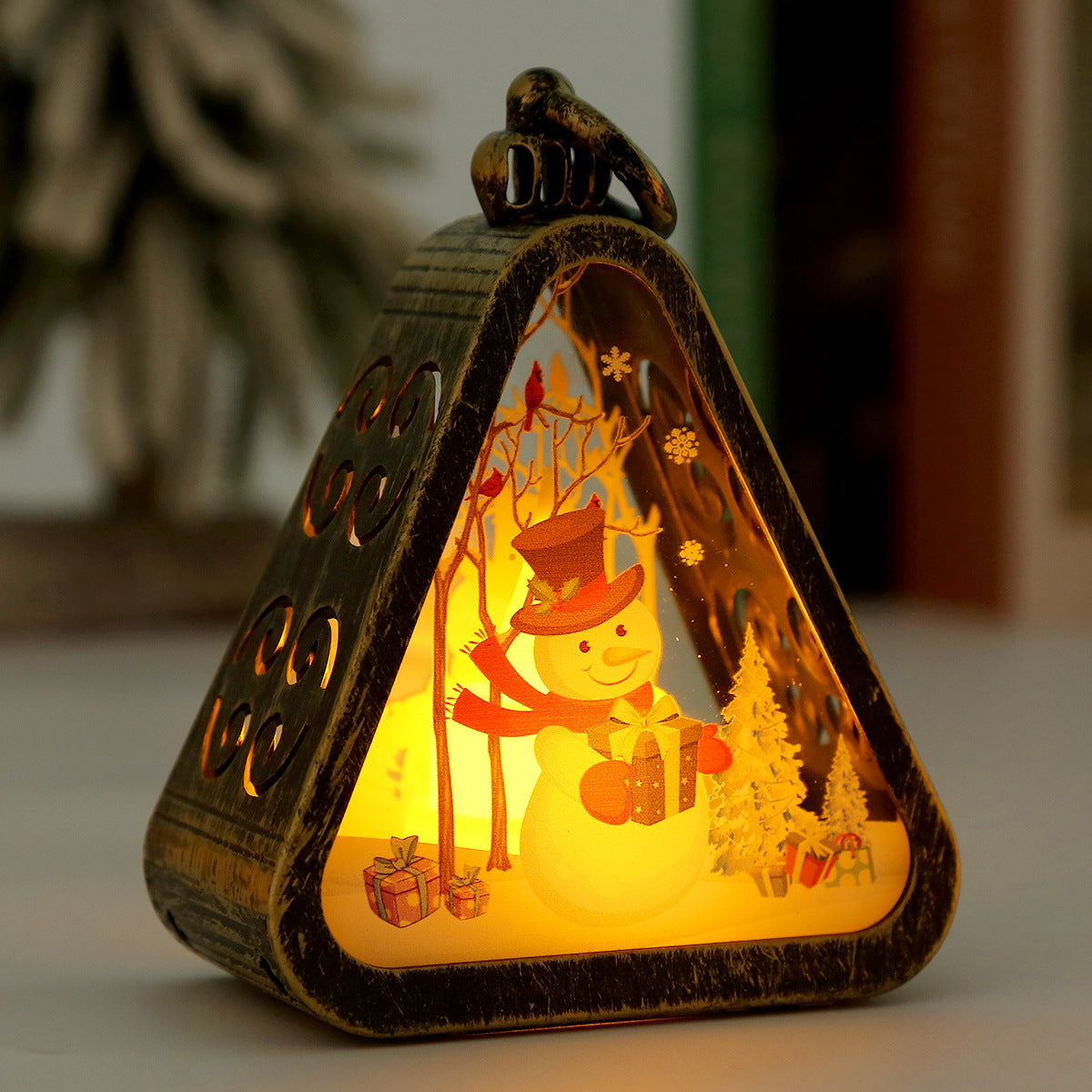 White snowman and bronze elk candle lamps side by side display