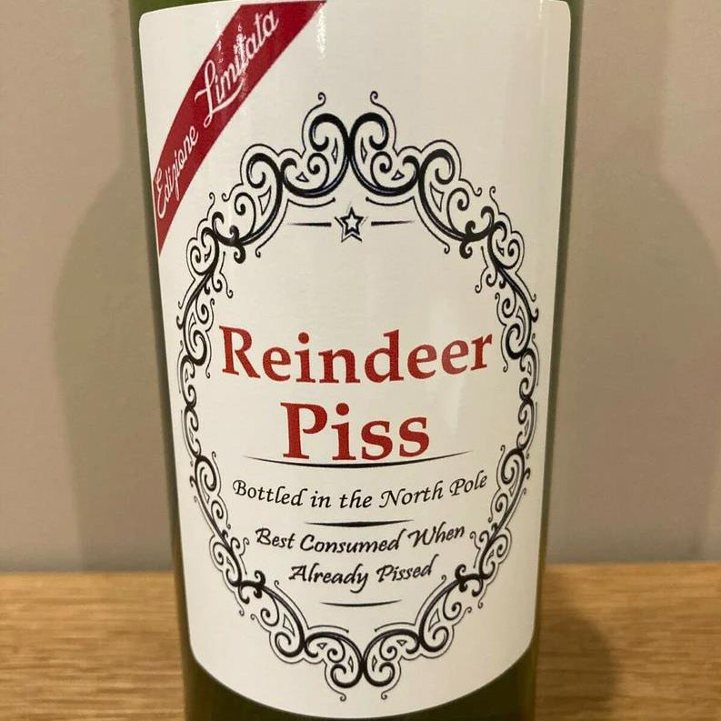 Close-up of American-style Christmas bottle label sticker with holiday motifs