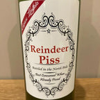 Close-up of American-style Christmas bottle label sticker with holiday motifs