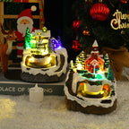 Rotating Christmas train resin decoration on wooden platform with festive details