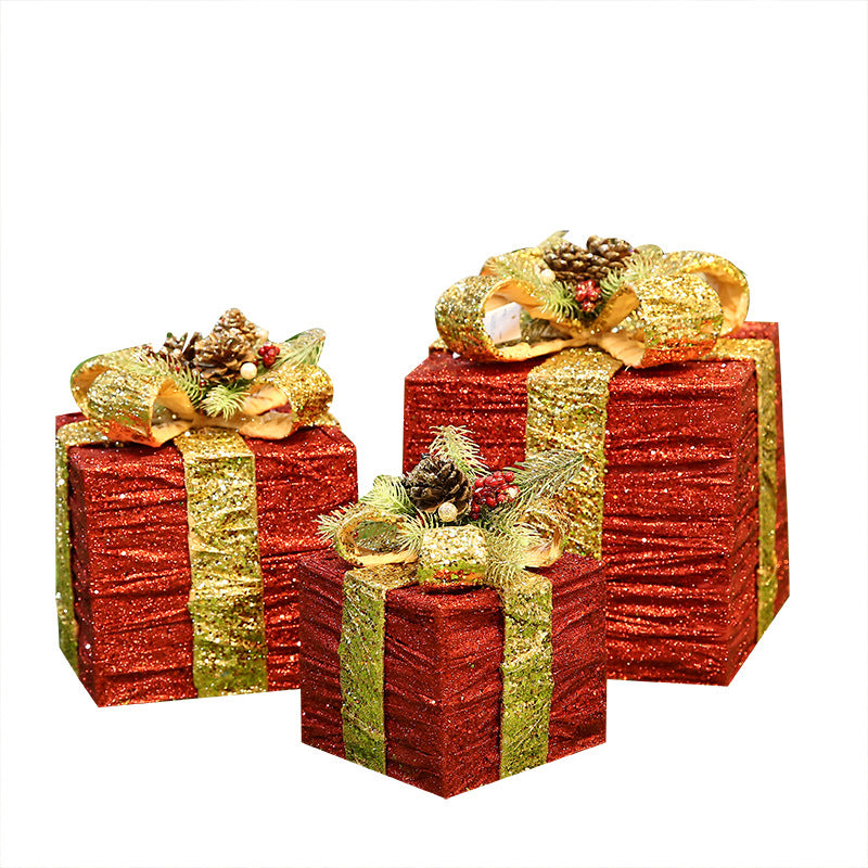 White iron Christmas gift box set on wooden shelf display
