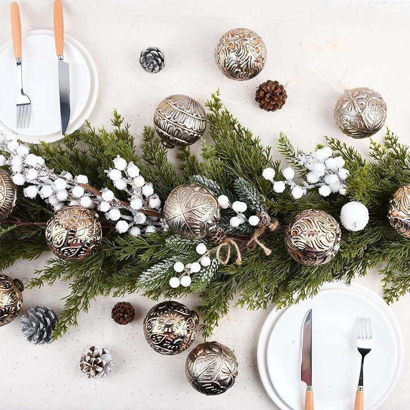 Group of 12 classical Christmas ornaments displaying varied gold tones