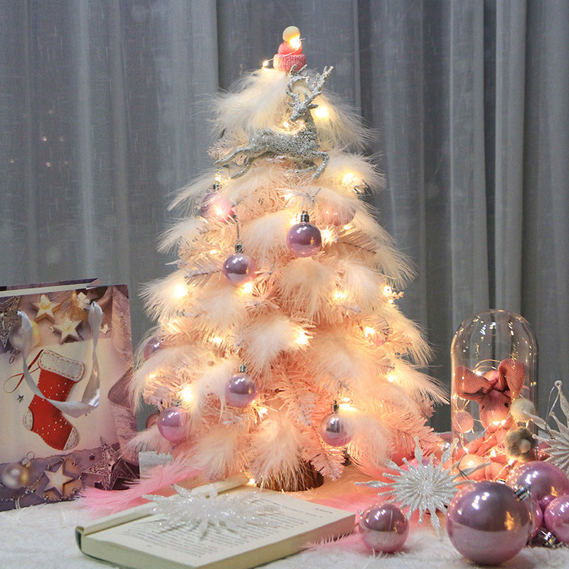 Delicate pink feathers on miniature Christmas tree decoration
