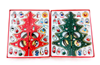 Red and green hand-painted wood Christmas tree on desktop with holiday greenery