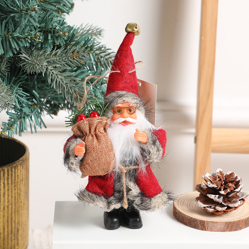 Red standing Santa doll with gift bag for Christmas decorating