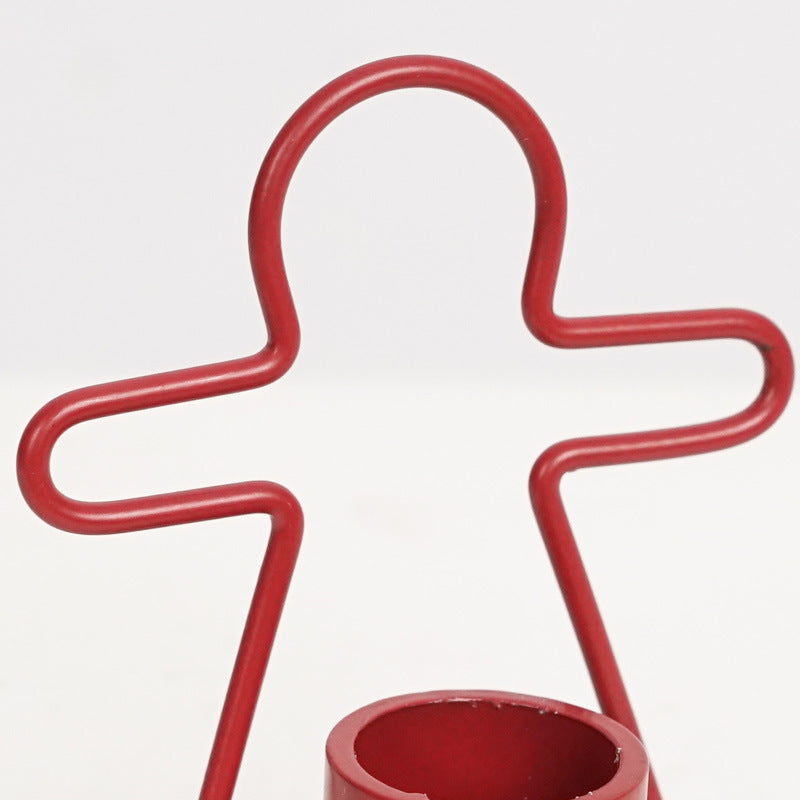 Iron candlestick with gingerbread man design in red finish