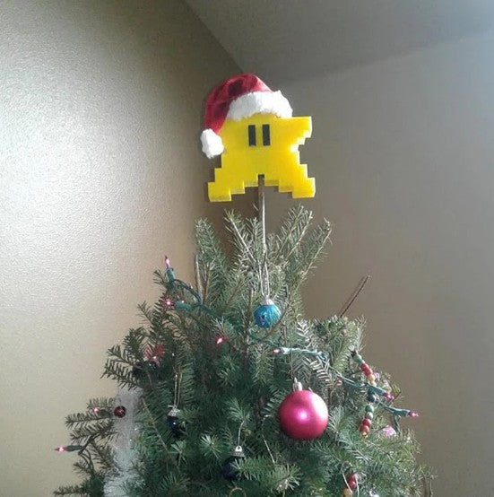 Yellow pixelated five-pointed star foam Christmas ornament with festive holiday styling