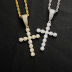 Close-up of zircon stones set in copper cross pendant