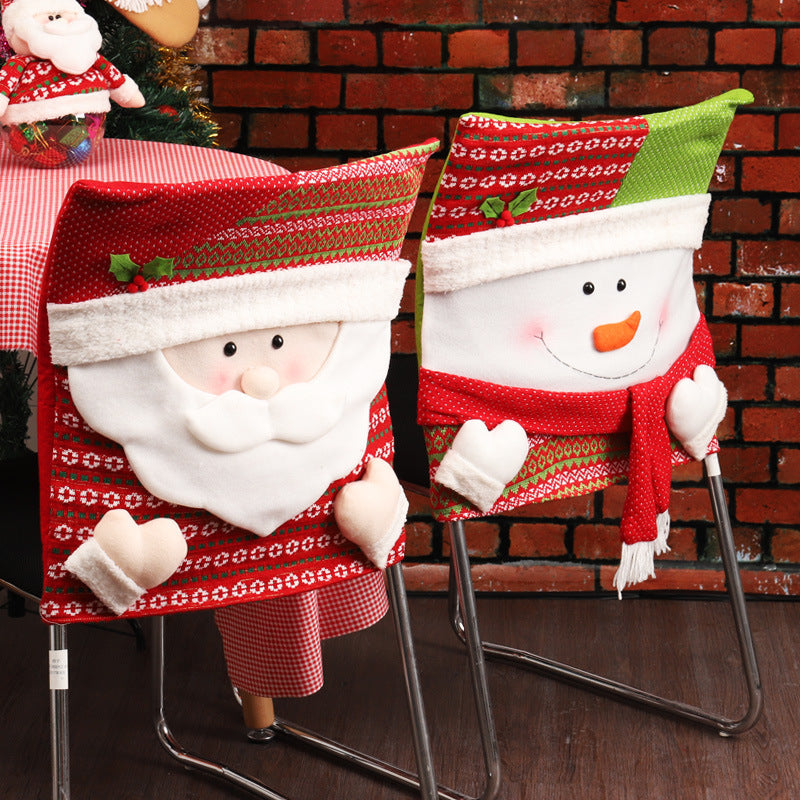 Festive Santa Claus chair back covers with gold bell and pom-pom embellishments