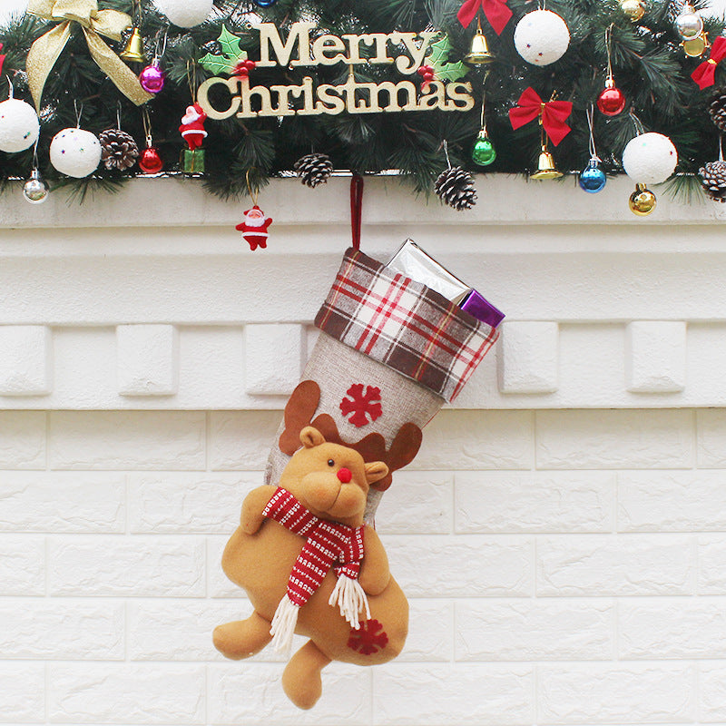 Christmas stocking ornament showcase with seasonal greenery background